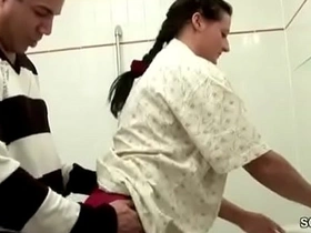 A young German guy gets caught in the bathroom and seduced by his older step-mom