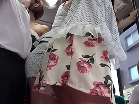 Clothed Asian girls having sex on a bus