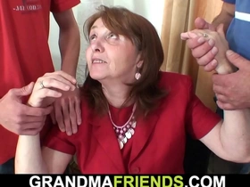 Busty mature seduces her boss for a steamy threesome